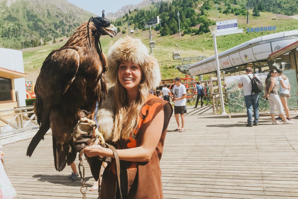 Holding an eagle in Kazakhstan - Travel to Central Asia