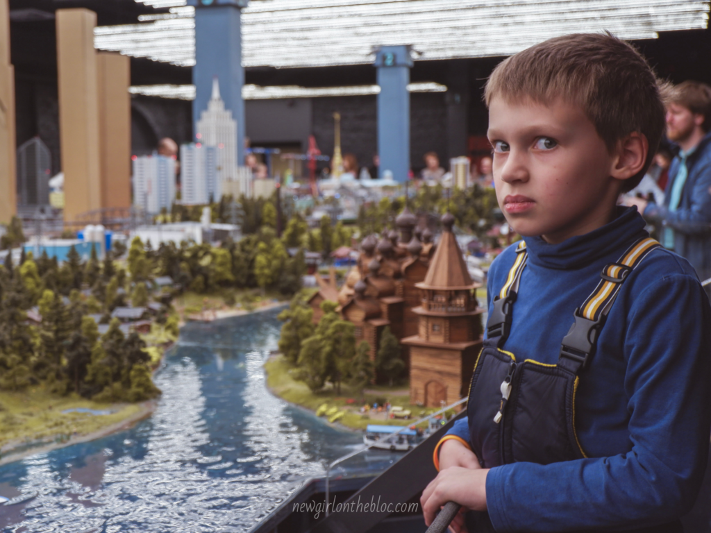 A Russian boy staring at me strangely as I take a picture of Russian miniatures - Culture Shock in Russia
