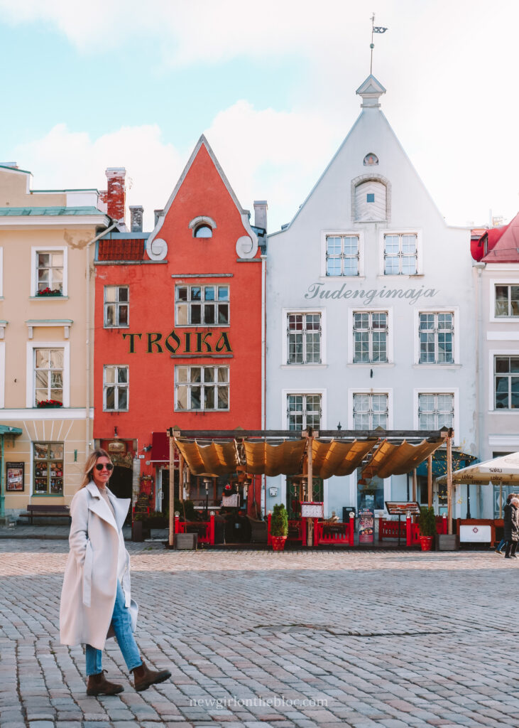 Me in front of the Troika Building in Tallinn's Town Hall Square - 10 Best Things to do in Tallinn, Estonia